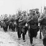 Soldiers sing as they march during the Russian Civil War.