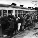 Supporters hang off the side of a Moscow tram on the way to a football game in 1933 (with thanks to Lev Borodulin's online collection www.borodulincollection.com)